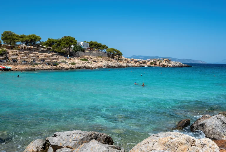 Greek catamaran sailing in a strong wind with reefed sails