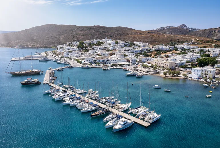 Aerial of an island port town with catamarans and sailboats on a pontoon