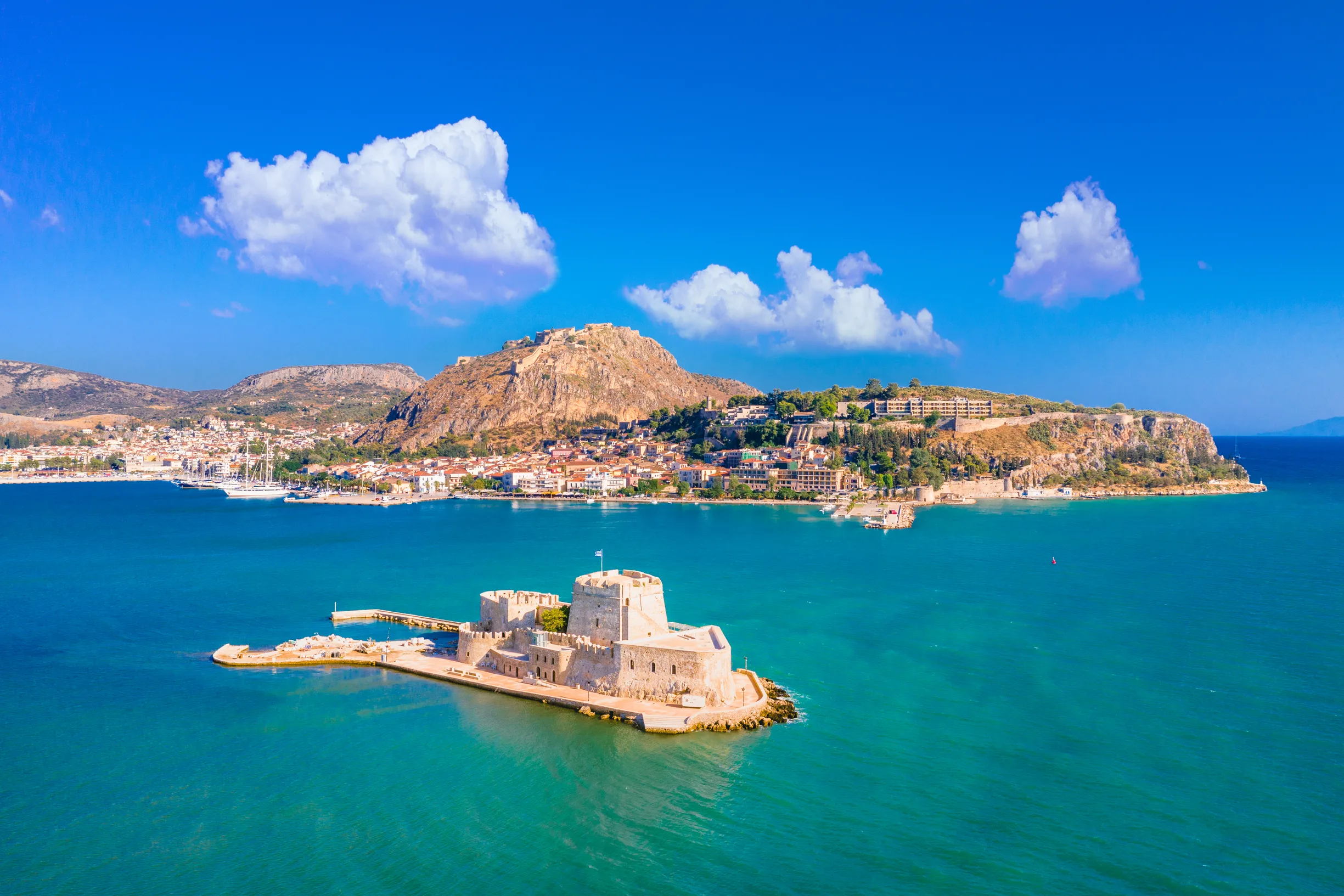 Bourtzi sea fortress islet off Nafplio with fortified hills behind