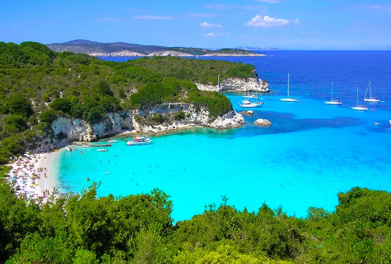Sailboats anchored off Voutoumi beach on Antipaxos