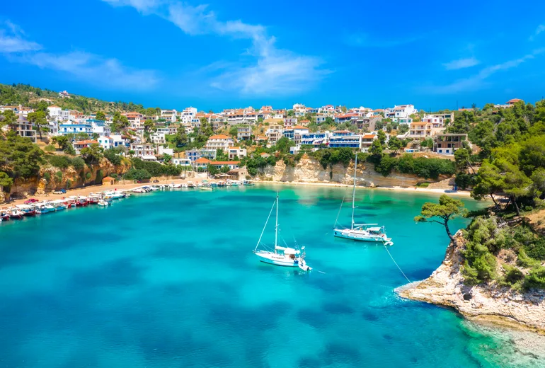 Sailboats on moorings in a cove on Alonissos in the Northern Sporades