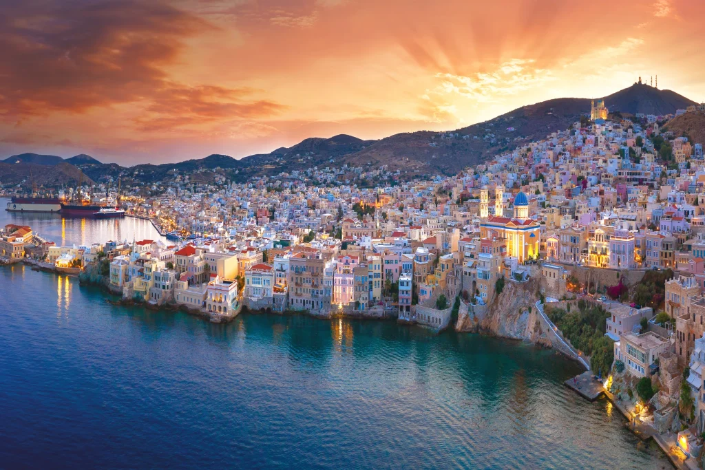Dramatic sunset panorama over Ermoupoli town waterfront, Syros