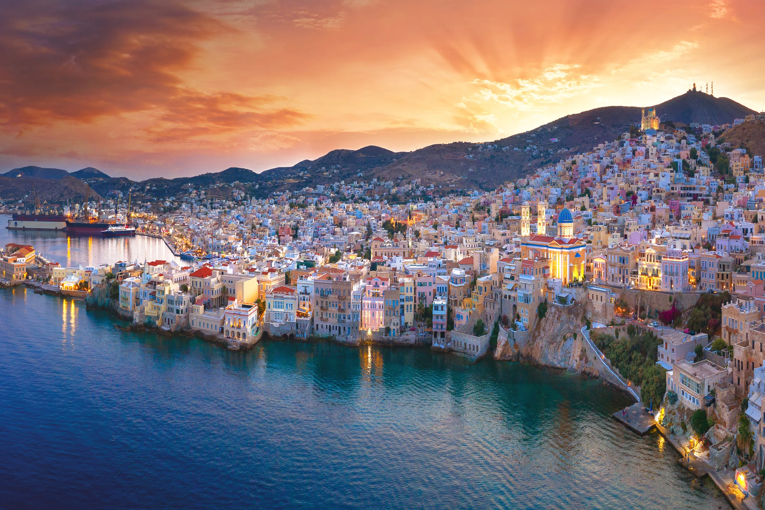 Dramatic sunset panorama over Ermoupoli town waterfront, Syros