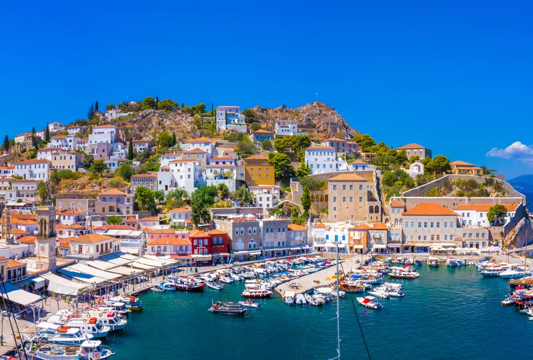 Yachts along the stone quay of Hydra harbour